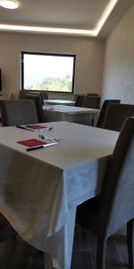 a conference room with a white table and chairs at Casa Barone in Roccadaspide