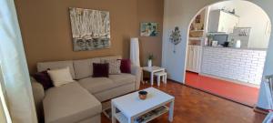 a living room with a couch and a table at Villa Lasta in Drasnice