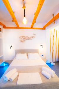 Katil atau katil-katil dalam bilik di Mantellina Suites