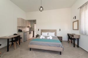 Postel nebo postele na pokoji v ubytování Loggos Apartments
