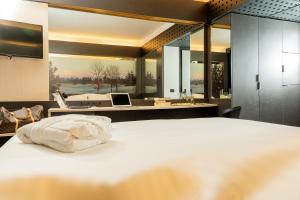 Postel nebo postele na pokoji v ubytování Hotel Pineta