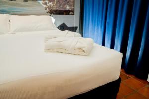 Postel nebo postele na pokoji v ubytování Hotel Pineta