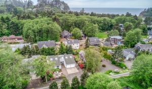 an aerial view of a house with a yard at Family Tides - Meredith Lodging in Neskowin