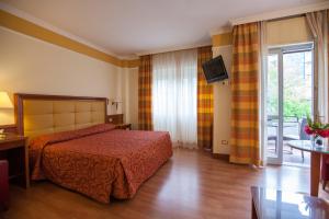 Postel nebo postele na pokoji v ubytování Hotel Il Chiostro by LVG Hotel Collection