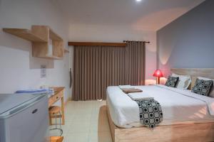 Postel nebo postele na pokoji v ubytování Adi Guest House