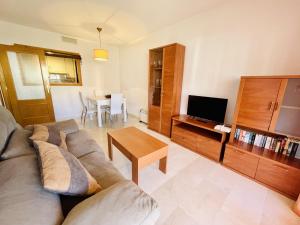 A television and/or entertainment centre at A436 - Balcón del Mar - 2004 Finestrat s.l.