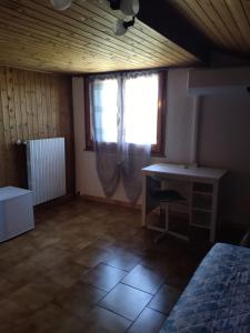 Postel nebo postele na pokoji v ubytování B&B A'la Funtäna