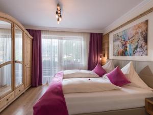 A bed or beds in a room at Appartements Fortuna