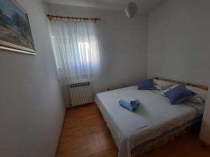 Katil atau katil-katil dalam bilik di Apartmani Anita