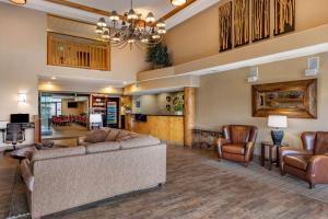 a living room with a couch and chairs at Comfort Suites Golden West on Evergreen Parkway in Evergreen
