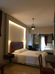 Posteľ alebo postele v izbe v ubytovaní Tasia Mountain Hotel