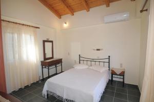Postel nebo postele na pokoji v ubytování Harmony Villas