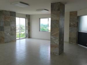 an empty room with stone walls and a large window at Hotel & Lounge Las Islas in San Juan Bautista Tuxtepec