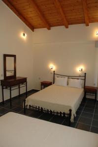 Postel nebo postele na pokoji v ubytování Harmony Villas