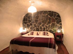 Cuevas Andalucia客房内的一张或多张床位