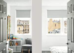 um quarto com uma janela e um quarto com uma cama em Fettes Hideaway em Edimburgo