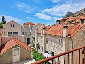 a view from the balcony of a town with buildings at Apartment Adagio in Omiš