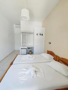 Voodi või voodid majutusasutuse Hotel Aegeon toas