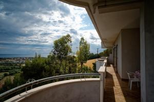 a balcony of a house with a view at La finestra sul mare in Madonna della Pace