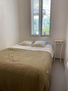Postel nebo postele na pokoji v ubytování Charmant appartement grande terrasse