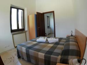 Posteľ alebo postele v izbe v ubytovaní Terrae Eremis: Ristorante, Bar, B&B