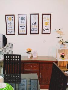 a dining room with four pictures on the wall at Family Villa C37 Batu in Batu