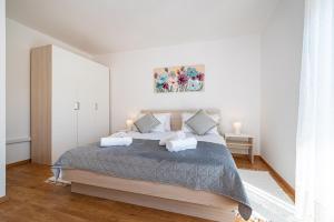 a bedroom with a large bed with two pillows at kuća za odmor ZARA in Stankovci +41 photos