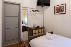 Postel nebo postele na pokoji v ubytování Seven Suites Pieve