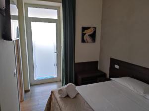 Postel nebo postele na pokoji v ubytování Le Bifore