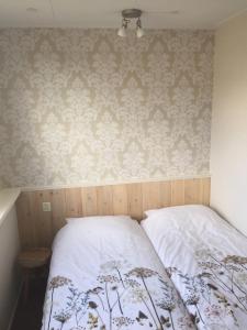 Postel nebo postele na pokoji v ubytování Texelstrand