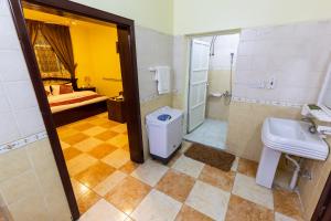 a bathroom with a sink and a toilet at العييري للوحدات المفروشة الباحة3 in Al Baha