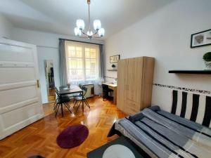 Posteľ alebo postele v izbe v ubytovaní Gecko Centrum Studio Apartman