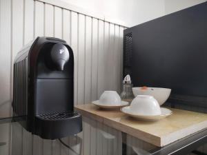 Příslušenství pro přípravu čaje a kávy v ubytování Atelier Keszthely