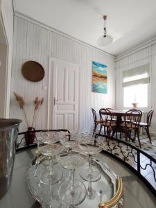 a dining room with wine glasses on a table at Atelier Keszthely in Keszthely