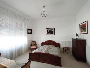 Postel nebo postele na pokoji v ubytování Atelier Keszthely