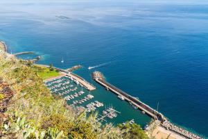 an aerial view of a marina with boats in the water at Casa Miradouro do Pigarro, Sunny Apartment in Calheta