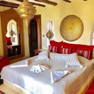 Letto o letti in una camera di Riad Cafe Du Sud