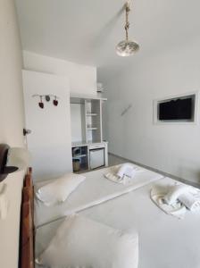 Voodi või voodid majutusasutuse Hotel Aegeon toas