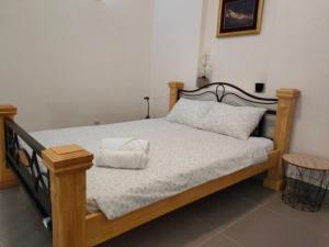 a bed with two pillows on it in a room at Studio Apartman Rea in Kotor