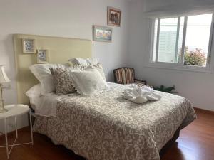 Łóżko lub łóżka w pokoju w obiekcie apartamento plaza del parque