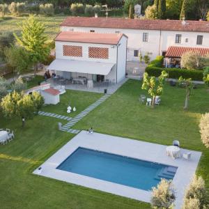 an aerial view of a house with a swimming pool at Podere Milla in Montale