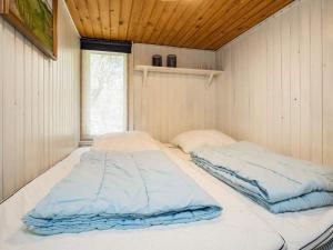 Postel nebo postele na pokoji v ubytování Holiday home Hurup Thy XVI
