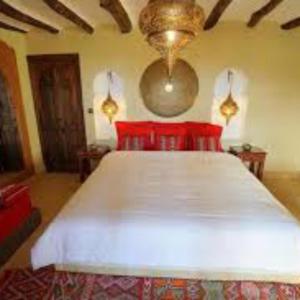 Letto o letti in una camera di Riad Cafe Du Sud