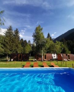 a view from the water of a swimming pool at Chalet Presanella in Temù