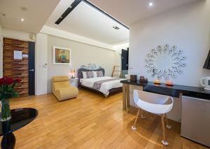 Postel nebo postele na pokoji v ubytování Han-Shian Boutique B&B