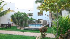 a courtyard with a swimming pool in a building at Al Jar Resort - Families Only in Rayyis