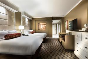 Postel nebo postele na pokoji v ubytování Golden Nugget Lake Charles