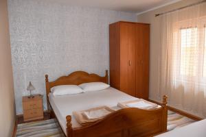 Postel nebo postele na pokoji v ubytování Apartmani Masa
