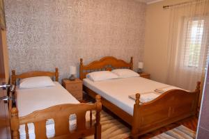 Postel nebo postele na pokoji v ubytování Apartmani Masa