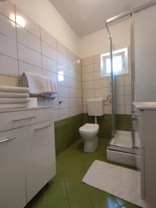 Koupelna v ubytování Apartments Laus